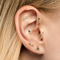 a close up of a person with ear piercings