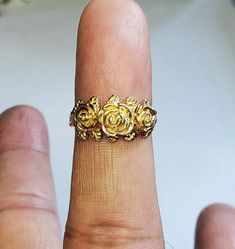 This is my latest ring to my flower collection. The ring is first hand carved in wax then cast into the metal. I love roses and this one especially because 3 roses means I love you. I've paid close attention to detail you will love this ring. Can be ordered in white gold, yellow gold. rose gold, and platinum. Comes is sizes 4 to 10. 100% Money back guarantee. Gold Promise Rings With Rose Design, Gold Flower Ring With Rose Design For Anniversary, Yellow Gold Rose Design Promise Ring, Yellow Gold Flower Ring With Rose Design For Anniversary, 14k Yellow Gold Flower Ring With Rose Design, Anniversary Yellow Gold Flower Ring With Rose Design, Rose Flower 14k Gold Anniversary Ring, Gold Rings With Rose Design For Anniversary, Anniversary Gold Rings With Rose Design