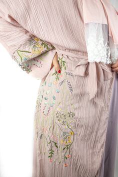 This Dusty Pink Floral Embroidered Abaya is perfect for any modern fashionista. Showcasing a beautiful faded pink with delicate embroidered floral detail, this Abaya will make you stand out in any occasion. This eye-catching mauve abaya is made of high quality textured fabric with floral embroidery along the sleeves and along the side of the abaya. The Floral Embroidered Abaya features buttons and a belt, providing you with the versatile options to wear it open or closed, tied or loose. Matching Embroidered Abaya, Textured Fabric, Dusty Pink, Floral Embroidery, Exclusive Designs, Pink Floral, Fabric Care, Size Chart, Embroidery