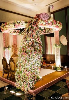 an elaborately decorated table with flowers and candles