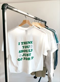 will come cropped like pictured  *message me if you want regular/full length :)  'I Think You Should Just Go For It' is on the back of the shirt and Sundaze circle logo on front side  green vinyl, white Gildan tee made to order ♡ unisex sizing * size chart measurements are in inches * Green And White Tshirt Outfit, T Shirt Business Aesthetic, I Think You Should Just Go For It, T Shirt With Messages, Text Tee Shirt, Tshirt Vinyl Design, Text On T Shirt, Positive Graphic Tees, T Shirt Marketing