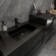 a bathroom sink sitting under a mirror next to a counter