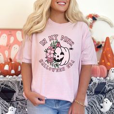 Welcome the Halloween season with serious comfort in our "In My Pink Halloween Era" Comfort Colors® t-shirt. This trendy tee features a retro pink pastel floral pumpkin graphic that transports you to the charming era of Halloween fun. Crafted with meticulous attention to detail, it showcases Comfort Colors®'s legendary softness and durability.  Whether you're carving pumpkins or sipping apple cider, this tee guarantees a stylish and cozy experience. ♥ ♥ ♥ Thank you for stopping by ♥ ♥ ♥ 👉How to Pink Graphic Print T-shirt For Fall, Retro Halloween Fan Merch T-shirt, Pink Halloween T-shirt With Letter Print, Pink Halloween Graphic Tee, Pink Grunge Halloween T-shirt, Spooky Pink T-shirt For Halloween, Pink Cotton T-shirt For Halloween, Retro Pumpkin, Pumpkin Graphic