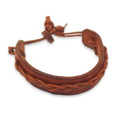 This simple but attractive bracelet for men is crafted by Gill Quarcoopome in Ghana. The artisan crafts the wristband from warm tan leather accented by a braided cord of leather in a slightly lighter shade. The casual bracelet is secured with a leather button clasp. Classic Handmade Adjustable Leather Bracelet, Classic Adjustable Leather Bracelet With Waxed Finish, Classic Adjustable Brown Bracelets, Classic Handmade Adjustable Braided Bracelets, Classic Adjustable Leather Bracelet, Adjustable Vintage Bracelets, Handmade Classic Braided Bracelets, Classic Adjustable Handmade Braided Bracelets, Adjustable Brown Bracelet