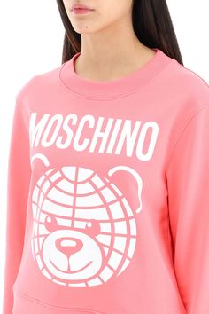 Cropped-cut crew-neck sweatshirt in loop-back cotton jersey by Moschino, featuring the Teddy branded print on front. Regular fit, ribbed edges. The model is 177 cm tall and wears a size IT 38. Size Info IT Color Detail Pink Made In Portugal Material 100% CO Season One spring Season Two summer Product clothing Brand Moschino Size And Fit