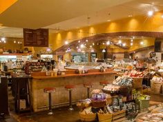 the inside of a grocery store filled with lots of food