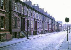 an empty city street lined with brick buildings