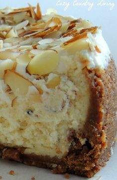 a piece of cheesecake with nuts on top