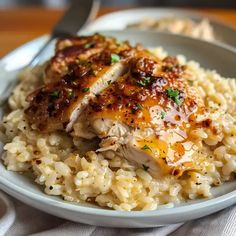 a white plate topped with chicken and rice