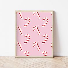 a pink wall with candy canes on it