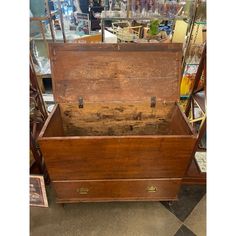 an old wooden chest sitting on display in a store