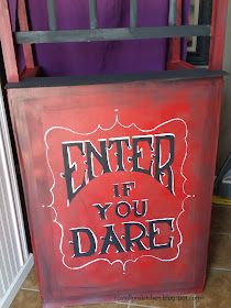 a red box with the words enter if you dare painted on it in black lettering