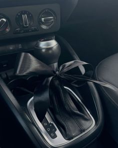 the interior of a car with a black bow on it