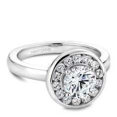 a white gold engagement ring with diamonds on it