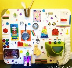 a refrigerator covered in lots of magnets and kitchen utensils on top of it