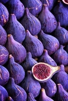 a pile of purple figs sitting next to each other