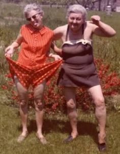 two older women standing next to each other in front of a black and white photo with the caption reminder your girlfriends will probably outlive