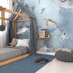 Cozy boy's bedroom with a canopy bed and an expansive undersea wall mural. The mural depicts lifelike illustrations of marine life such as a hammerhead shark, jellyfish, sea turtle, and a playful octopus. The bed is adorned with a grey bedspread, starry grey canopy, and a cushioned pouf nearby, creating an inviting ocean-themed nursery atmosphere Under The Sea Interior Design, Whale Themed Bedroom, Mural In Nursery, Modern Blue Nursery, Coastal Toddler Boy Room, Shark Toddler Room, Under The Sea Bedroom Ideas Boys, Ocean Themed Playroom, Ocean Theme Toddler Room