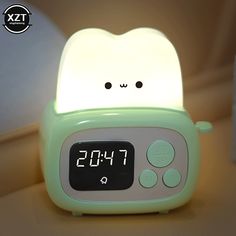 the alarm clock is shaped like a cat