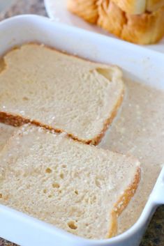 two slices of bread in a white dish