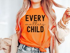 Support Indigenous awareness with our Every Child Matters shirt, designed to honor Orange Shirt Day 2024 and promote Truth and Reconciliation. A portion of every purchase of tgis September 30th Tshirt goes directly to Indigenous First Nations causes, making this tee not just a statement, but a contribution.   Please review all photos for respective size charts. How to Order: 1. Review all photos. 2. Choose your size from the drop-down menu. 3.Add to cart and repeat for additional items. PROCESSI Cotton Graphic Print Shirt For Awareness Events, Cotton Shirt With Graphic Print For Awareness Events, Casual Crew Neck Shirt For Awareness Events, Casual Cotton Shirt For Awareness Events, Pre-shrunk Graphic Tee For Awareness Events, Cotton Tops With Letter Print For Awareness Events, Truth And Reconciliation, Orange Shirt Day, Every Child Matters