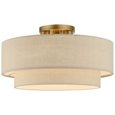 a light fixture with a beige shade on the bottom and a white drum lamp below it