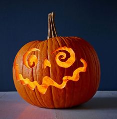 a carved pumpkin sitting on top of a table