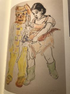 an open book with a drawing of two people