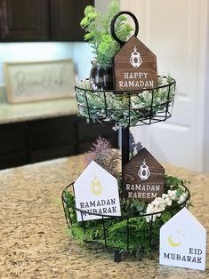 three tiered trays with labels on them sitting on a kitchen counter