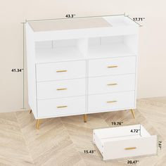 a white dresser with gold handles and drawers next to the measurements for its drawer size