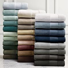 towels stacked on top of each other in different colors