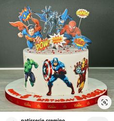 the cake is decorated with superheros and stars