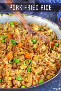 pork fried rice with peas and carrots in a skillet