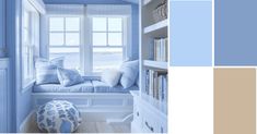 a blue and white color scheme with bookshelves, window seat, and ottoman