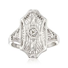 Ross-Simons - C. 1950 Vintage Diamond-Accented Filigree Ring Round Cut in 18kt White Gold. Size 5. C. 1950. Fantastic filigree...a Retro-era signature! From our Estate collection, this geometric-inspired cocktail ring features a single round brilliant-cut diamond accent at the center of intricate filigree openwork. Finely crafted in polished 18kt white gold. 11/16" wide. Diamond-accented ring. Exclusive, one-of-a-kind Estate Jewelry. Diamond birthstones are the perfect gift for April birthdays. Luxury Vintage White Gold Filigree Ring, Luxury Collectible Filigree Rings, Classic Hallmarked Filigree Ring Collectible, Luxury Antique Filigree Collectible Ring, Accented Ring, Antique Diamond Filigree Ring Collectible, Jewelry Presentation, Retro Era, Antique Jewelry Rings