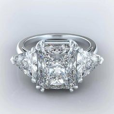 three stone diamond ring with side stones in white gold and diamonds on the sidestones