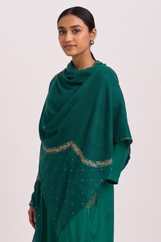 Emerald shawl with frayed edges and zari embroidered motifs.
Component: 1
Pattern: Embroidered
Type Of Work: Zari Work
Fabric: Woollen
Color: Green
Other Details: 
Frayed edges
Zari embroidered
Note: Kurta and pant worn by the model is not for sale
Occasion: NA - Aza Fashions Embroidered Shawl, Embroidered Motifs, Zari Work, Fashion App, Not For Sale, Aza Fashion, Shawl, Emerald, Dots