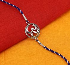 his is fabulous free size OM Bracelet, We can use either as Bracelet of Rakhi bracelet.925 sterling silver customized super Rakhi bracelet, best gift for your brother's, Amazing OM Design rakhi bracelet.Metal-925 sterling silver.Item type-Rakhi Bracelet.Weight-5.090 grams.Size-Free size.Stamped-925 hallmarked.Best RakhshaBandhan gift for your brothers. Adjustable Sterling Silver Bracelets For Diwali, Adjustable Silver Bracelets For Diwali, Adjustable Fusion Style Sterling Silver Bracelet For Gift, Symbolic Sterling Silver Bracelets For Festivals, Round Bracelets Gift For Diwali, Diwali Gift Bracelets, Festival Gift Bracelets With Hallmark, Adjustable Traditional Sterling Silver Bracelet As Gift, Sterling Silver Bracelets For Festivals