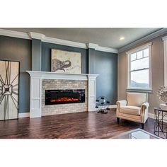 a living room filled with furniture and a fire place in the middle of the room