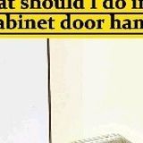 an advertisement for the cabinet door hanger is shown in black and white, with yellow lettering