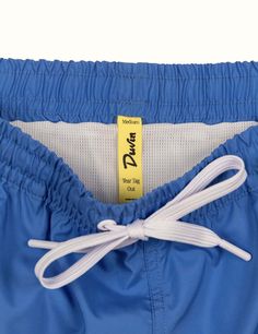 Our elastic Swim Shorts are your new go-to for leisurely days in the sun. These vintage trunks are made of 100% poly in a comfort short / wide fit. Every pair is equipped with a tearaway size tag for max waist comfort. Meet your new favorite beach trunk. Pair it with your favorite Duvin tee and hat. 100% Polyester Wide-leg relaxed fit Tearaway size tag 14.6'' size Medium outseam (scales up and down depending on size - we recommend sizing up if you want a little length 5'' inseam Premium soft box Blue Nylon Bottoms For Vacation, Blue Athletic Shorts With Elastic Waistband For Beach Season, Blue Athletic Shorts With Elastic Waistband For Vacation, Blue Summer Athletic Shorts With Comfort Waistband, Blue Bottoms With Elastic Waistband For Pool, Blue Nylon Bottoms For Summer, Blue Athletic Shorts For The Beach, Blue Athletic Shorts With Comfort Waistband For Summer, Casual Blue Athletic Shorts With Comfort Waistband