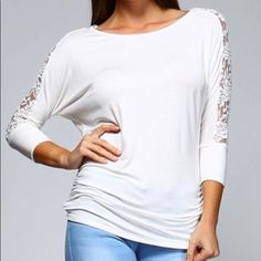 This Super Soft, 3/4 Sleeve Top Is Perfect For Weekend Brunch Or A Lunch Date! Ivory In Color, It’s Incredibly Versatile And Super Cute With The Lace Detail Across The Back Of The Shoulders And Down Each Sleeve! The Lace Is Slightly Stretchy To Give And Move With The Fabric Of The Top. Shirred On The Sides To Give A Bit Of Detail And Flow, This Top Is Long Enough To Cover All The Goodies Too! Made In The Usa! White Stretch Top With 3/4 Sleeve, White Fitted Top With 3/4 Sleeves, Stretch Brunch Top With 3/4 Sleeves, Stretch Top With 3/4 Sleeves For Brunch, White Half Sleeve Blouse For Brunch, Stretch Cream Top For Brunch, Cream Stretch Top For Brunch, Chic White Top With 3/4 Sleeves, Chic White 3/4 Sleeve Top