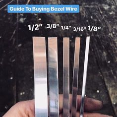 a hand holding four pieces of metal in front of a black background with the text guide to buying bezel wire