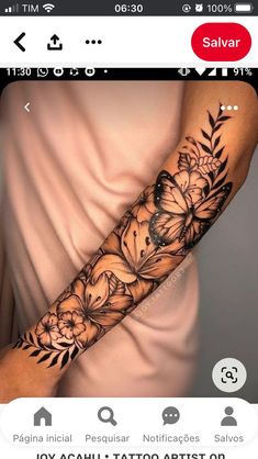 a woman's arm with flowers and butterflies tattooed on the side of her arm