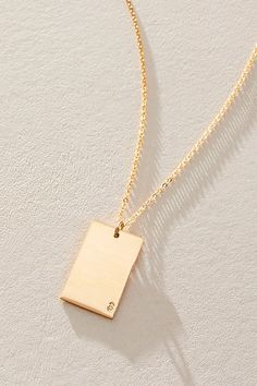 So unique in an understated design, this stunning necklace features a personalized rectangle pendant with initial engraved at corner for a super fun finishing touch. * 14k Gold Filled * 0.5x0.75" rectangle bar necklace with hand-stamped personalization * Length: 20" * 5 days of production | Set & Stones Personalized ie Necklace at Free People in Gold Rectangle Pendant, Accessories Jewelry Necklace, Stunning Necklace, Bar Necklace, Hand Stamped, Womens Jewelry Necklace, Gold Filled, Jewelry Accessories, Initials