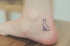 small cat tattoo on the foot