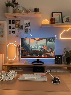 a computer monitor sitting on top of a wooden desk next to a keyboard and mouse