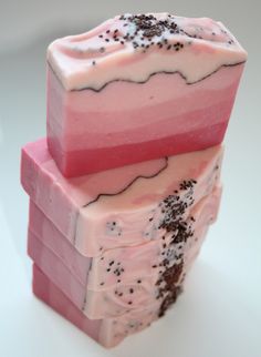 three soap bars stacked on top of each other with black and white sprinkles