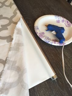 a paper plate with a blue plastic horse on it next to an electric charger