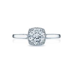 a diamond engagement ring with two rows of diamonds on the band and an oval center stone